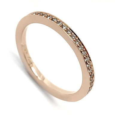 14kt rose gold wedding ring with pave-set Canadian diamonds, angled view