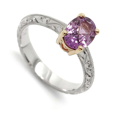 14kt white and yellow gold engagement ring with oval pink-purple sapphire and engraved band