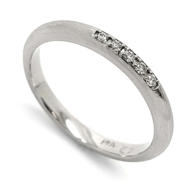 14kt white gold wedding ring with a row of Canadian diamonds and brushed finish