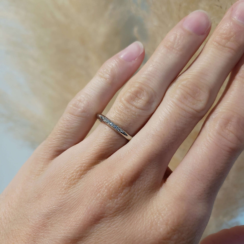 14kt white gold Canadian diamond wedding ring worn on a hand