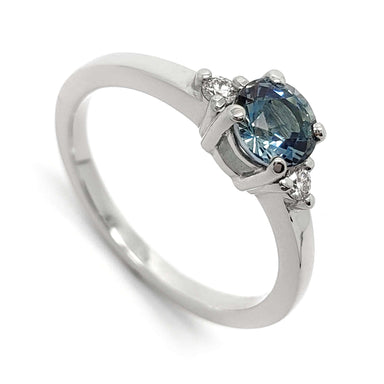 14kt white gold ring with round blue Montana sapphire and two Canadian diamonds
