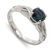 Handcrafted 14kt white gold ring with round blue Montana sapphire and interlace millgrain detail