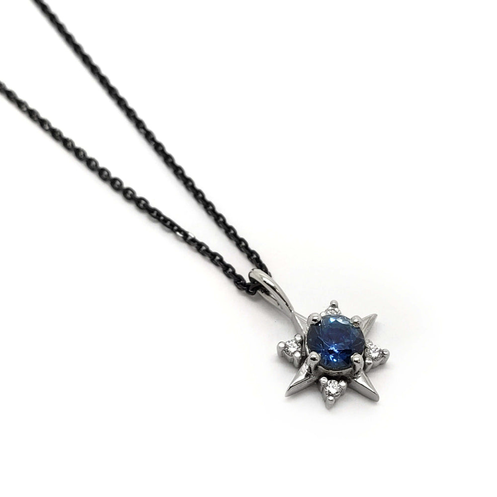 14kt white gold star-shaped pendant with blue Montana sapphire and lab diamonds on chain