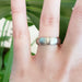 14kt white gold brushed wedding ring with domed step profile shown on hand