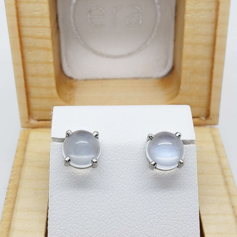 14kt white gold cabochon moonstone studs displayed in a wooden jewellery box