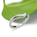 14kt white gold chevron millgrain wedding band beside a green leaf