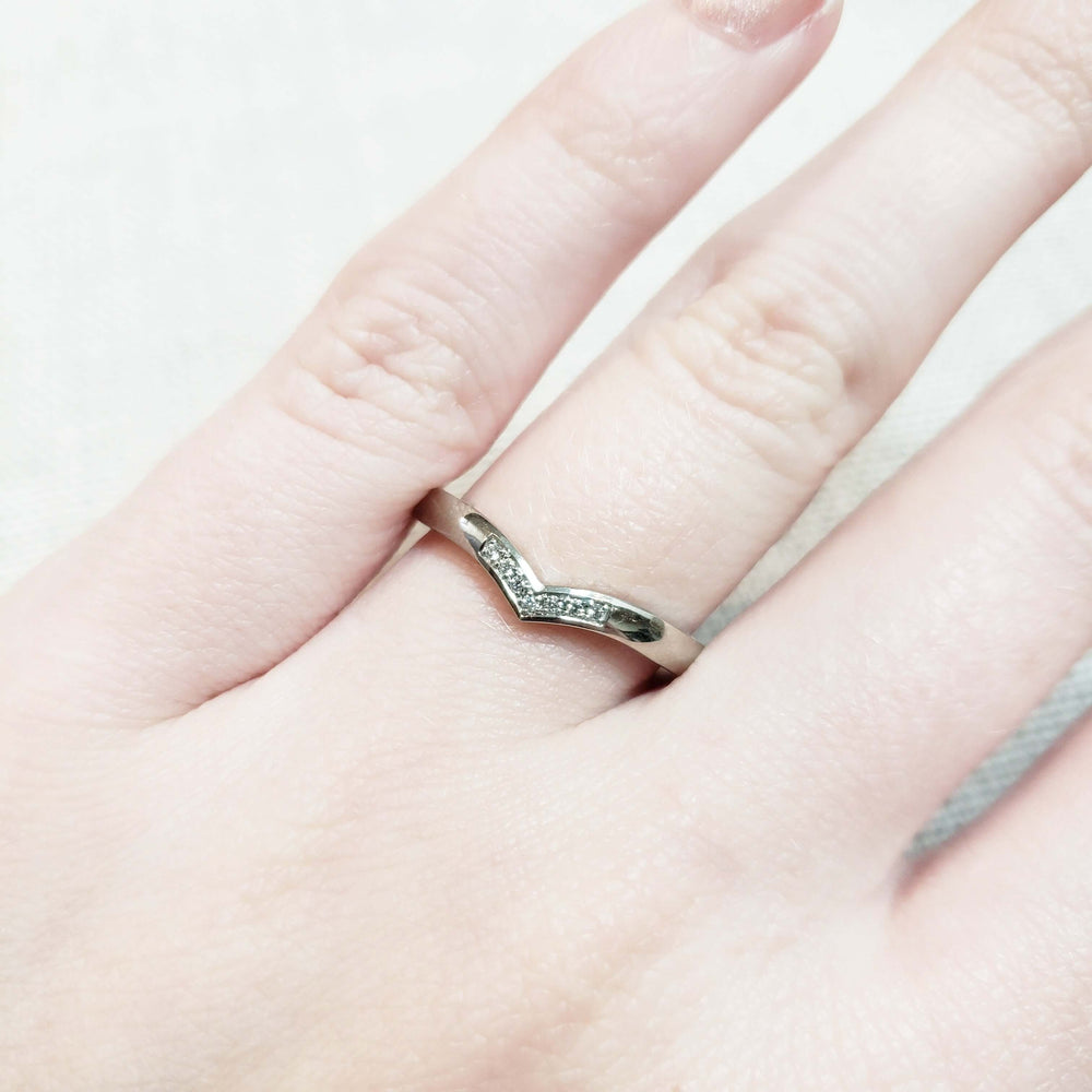 14kt white gold chevron pavé diamond wedding ring worn on hand