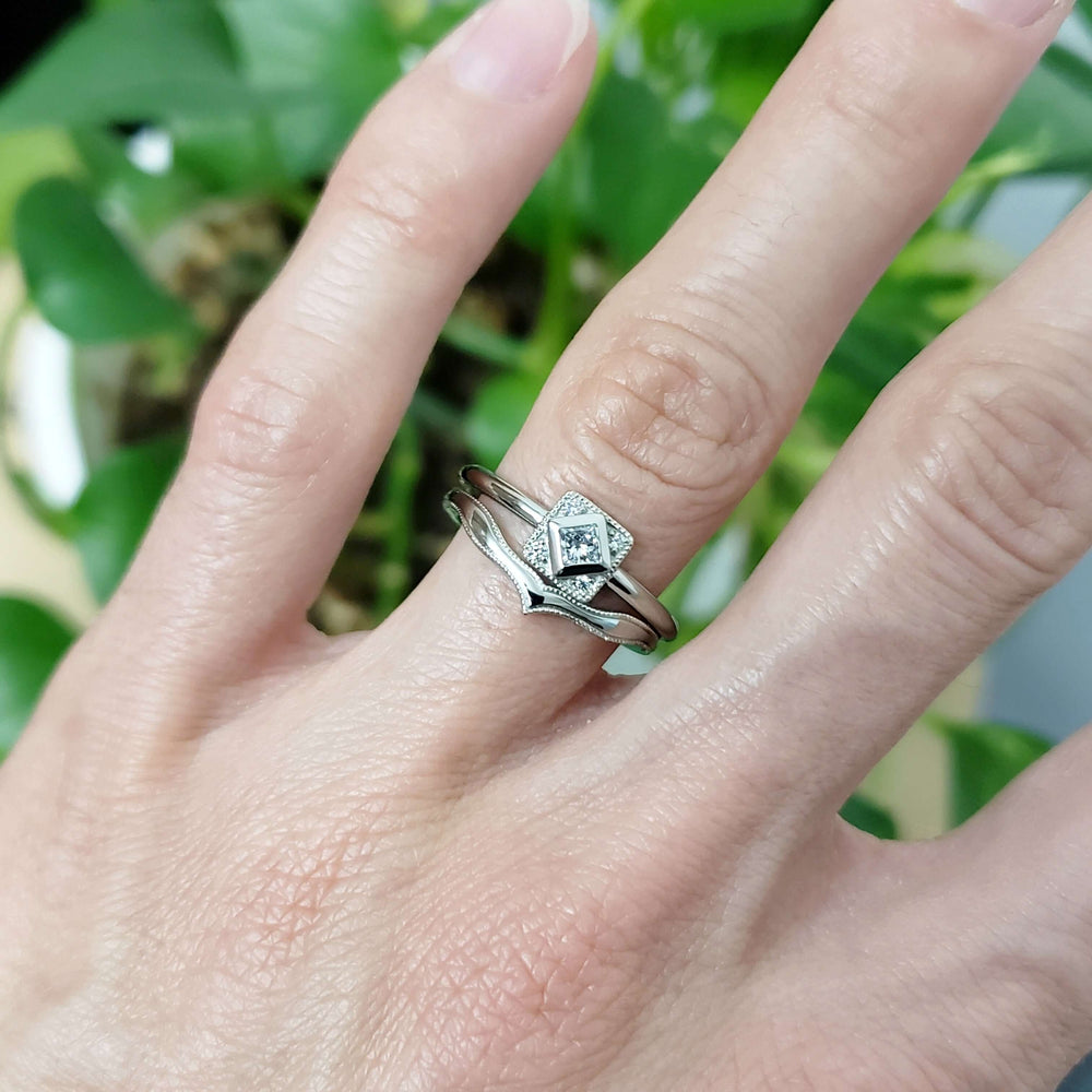 14kt white gold chevron wedding ring stacked with a square diamond engagement ring