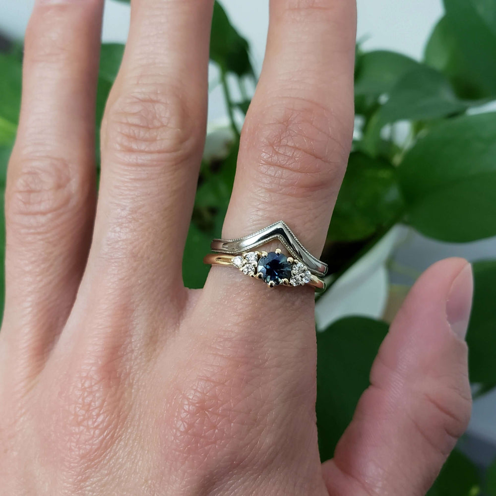 14kt white gold chevron wedding ring with millgrain, stacked with sapphire and diamond engagement ring