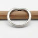 14kt white gold chevron wedding ring with millgrain, top view on pencil