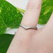 14kt white gold chevron wedding ring with saw blade texture shown on finger