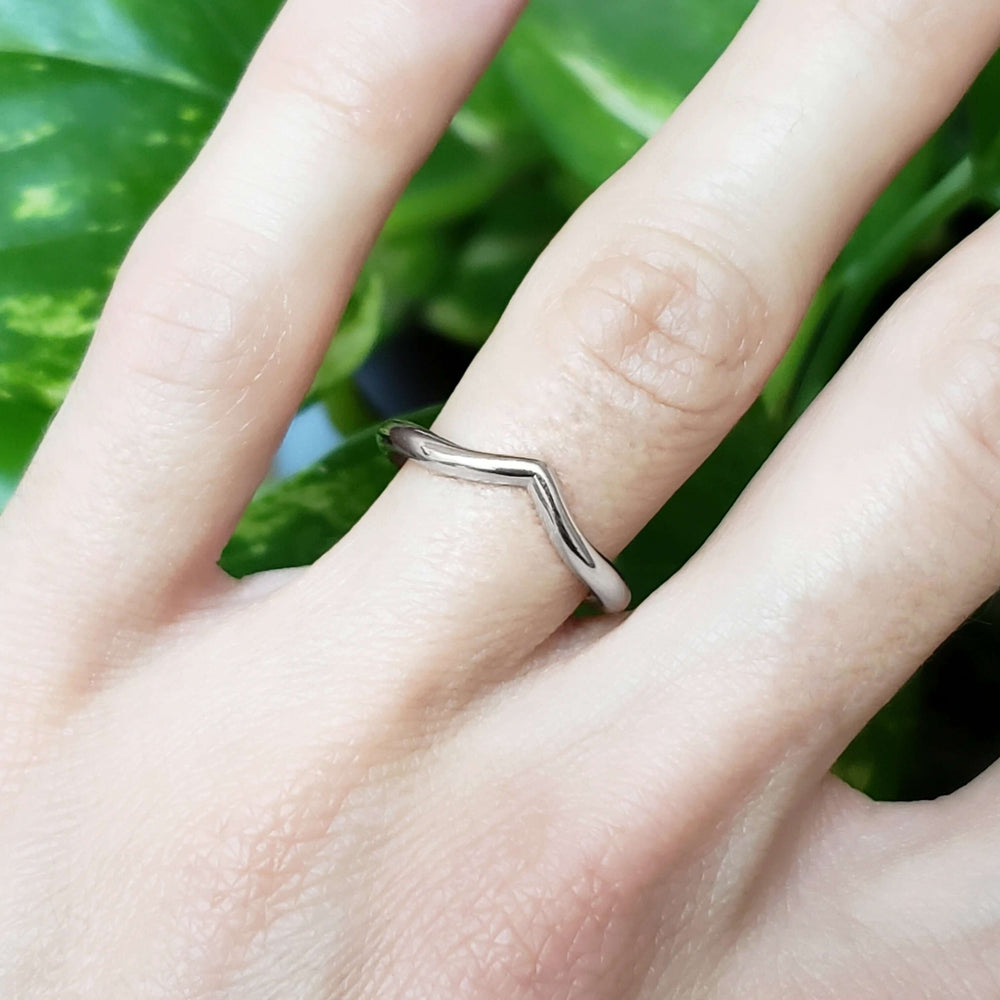 14kt white gold chevron wedding ring worn on hand