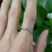 14kt white gold diamond chevron ring worn on hand