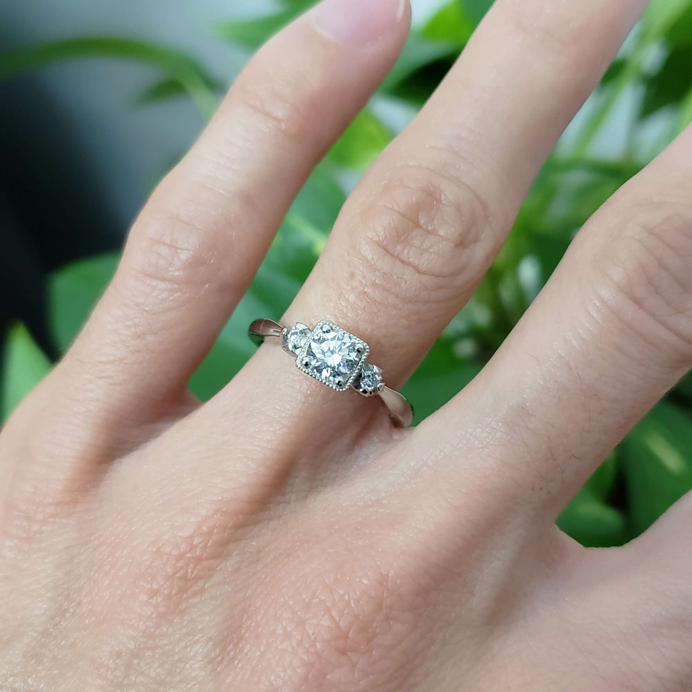 14kt white gold diamond engagement ring worn on a hand