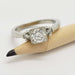 14kt white gold diamond ring with millgrain detail shown beside a pencil for scale
