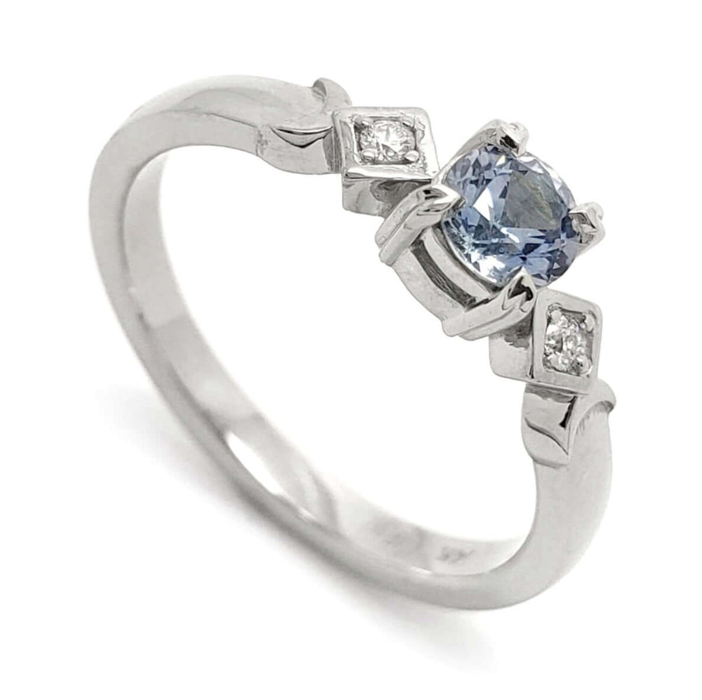 14kt white gold engagement ring with round blue Montana sapphire and Canadian diamonds