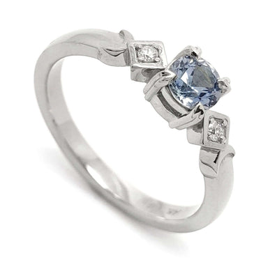 14kt white gold engagement ring with round blue Montana sapphire and Canadian diamonds