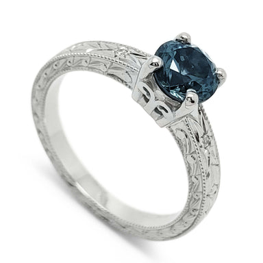14kt white gold engagement ring with blue Montana sapphire and engraved band