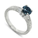 14kt white gold engagement ring with blue Montana sapphire and engraved band