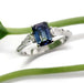 14kt white gold engagement ring with blue emerald cut sapphire and pear shaped diamonds, front view