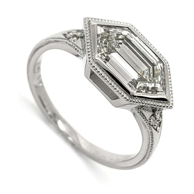 14kt white gold engagement ring with elongated hexagon lab diamond and milgrain detail