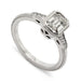 14kt white gold engagement ring with emerald cut lab diamond and side diamonds, millgrain detail