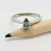 14kt white gold engagement ring with marquise blue-green Montana sapphire on pencil