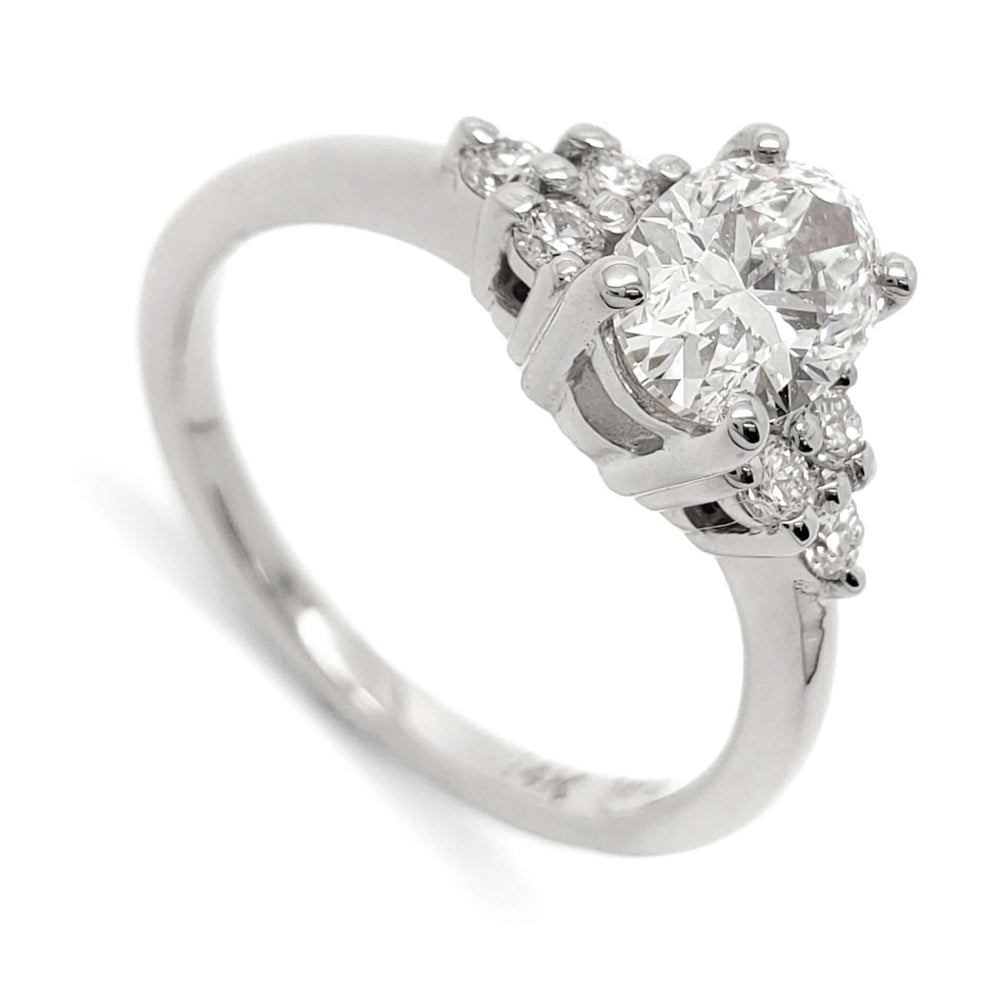 14kt white gold engagement ring with oval lab grown diamond and round diamond accents