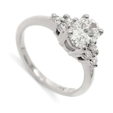14kt white gold engagement ring with oval lab grown diamond and round diamond accents