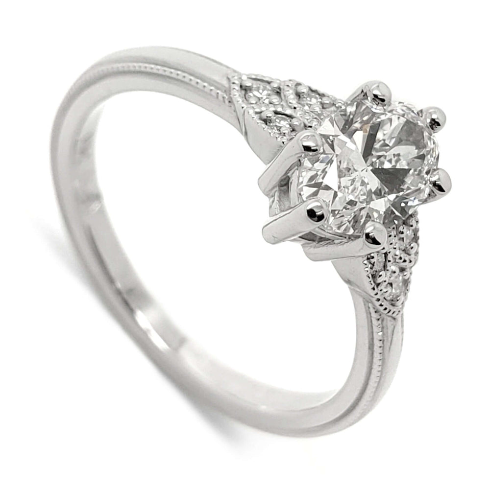 14kt white gold engagement ring with oval lab grown diamond and millgrain detail
