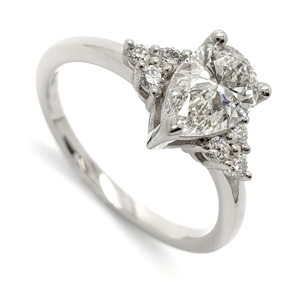 14kt white gold engagement ring with pear cut lab grown diamond and round accent diamonds