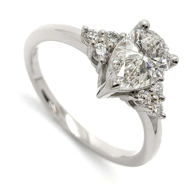14kt white gold engagement ring with pear cut lab grown diamond and round accent diamonds
