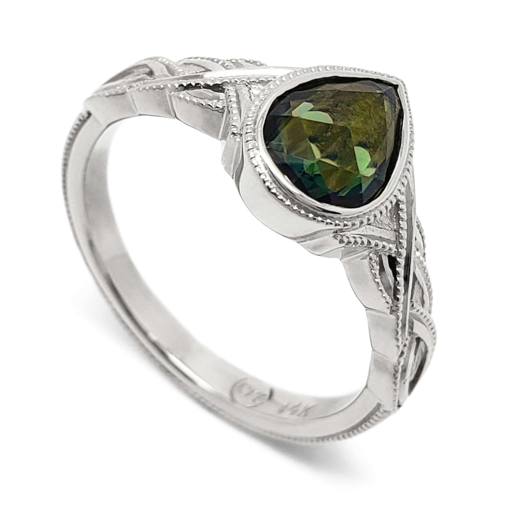 14kt white gold engagement ring with pear rose cut green sapphire and millgrain detail