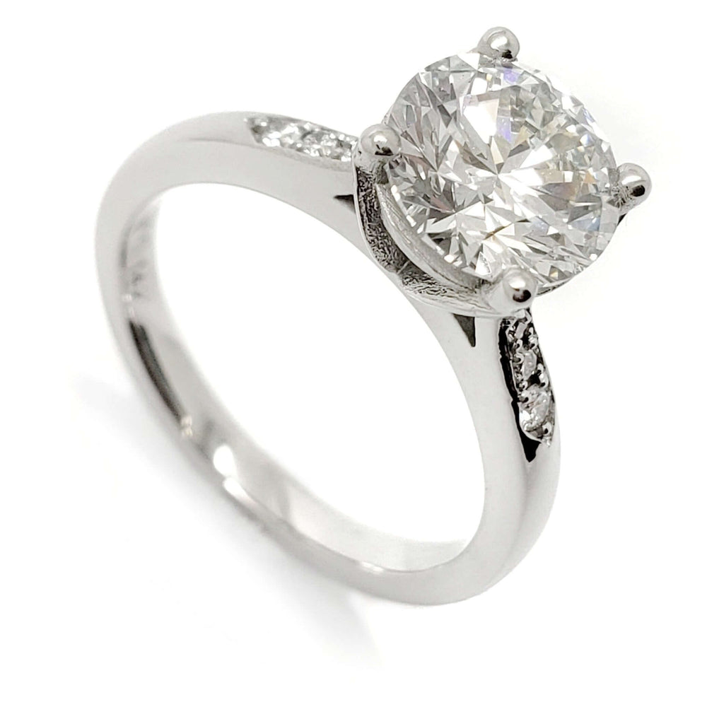 14kt white gold engagement ring with round lab grown diamond and pave-set band