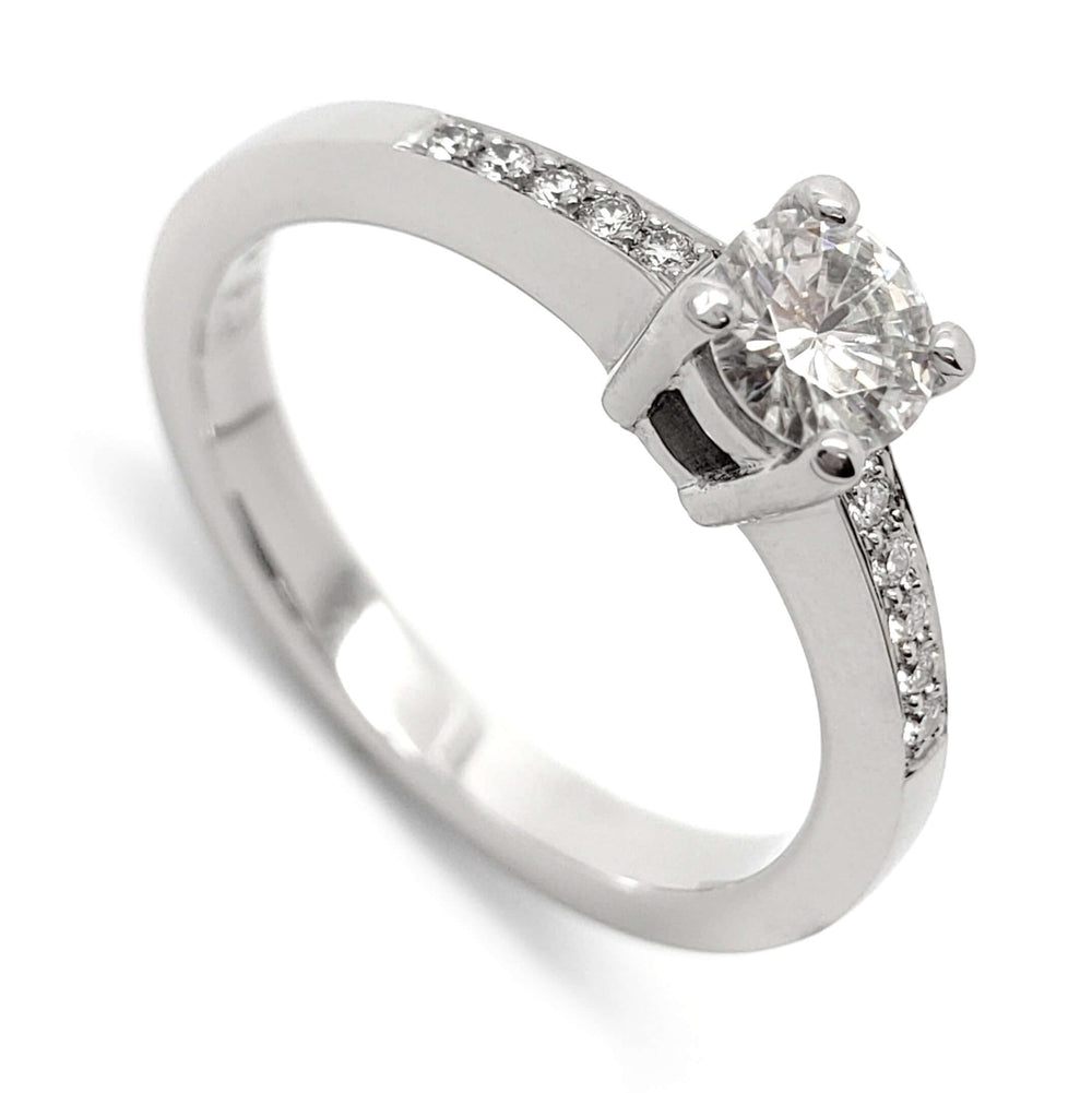 14kt white gold engagement ring with round moissanite and pave-set lab diamonds