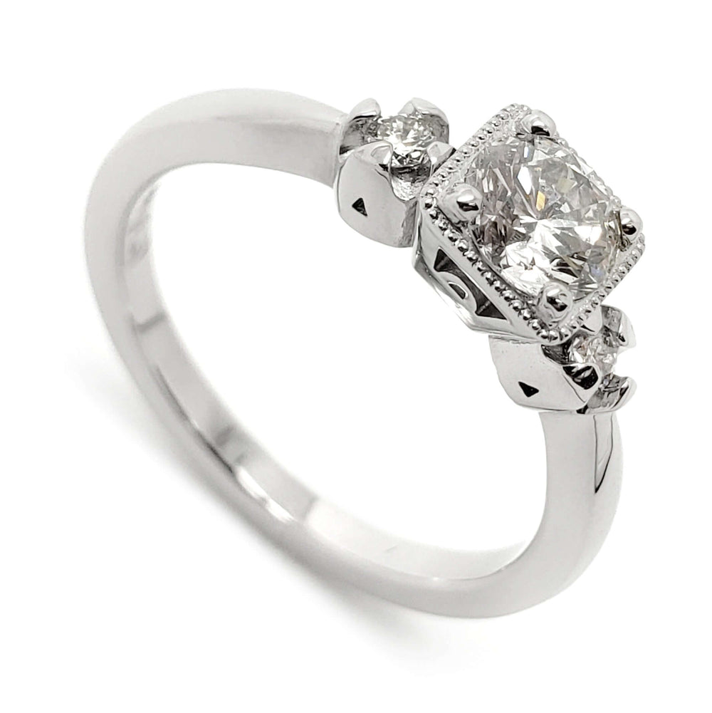 14kt white gold engagement ring with three reclaimed antique diamonds and millgrain detail