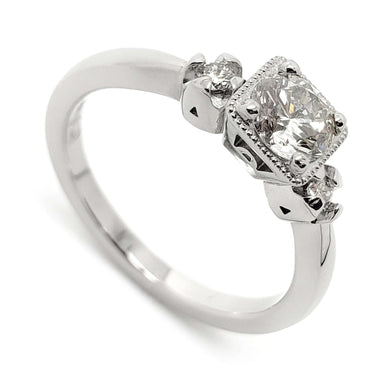 14kt white gold engagement ring with three reclaimed antique diamonds and millgrain detail