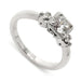 14kt white gold engagement ring with three reclaimed antique diamonds and millgrain detail