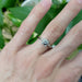 14kt white gold lab diamond engagement ring worn on a hand