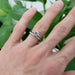 14kt white gold lab diamond engagement ring stacked with a pave wedding band on hand