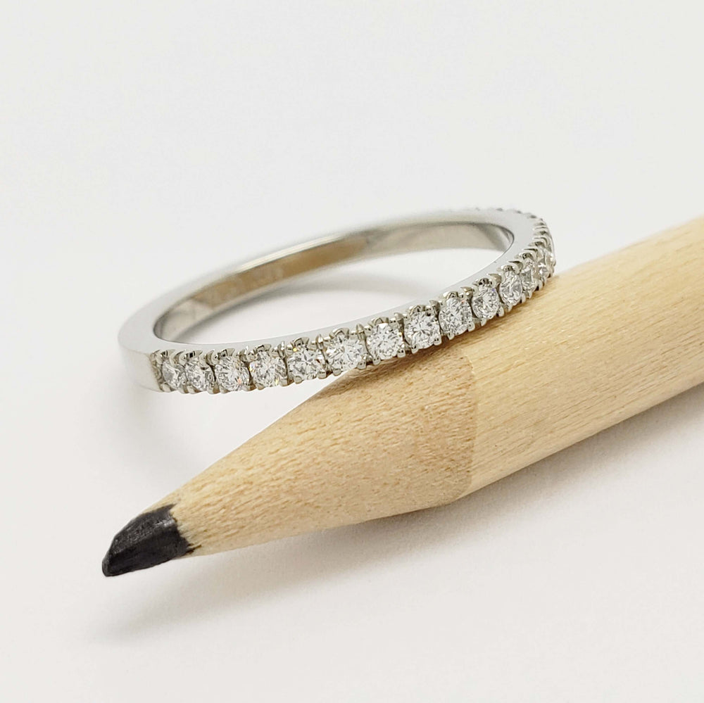 14kt white gold lab diamond wedding ring shown with pencil for scale