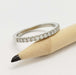 14kt white gold lab diamond wedding ring shown with pencil for scale