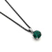 14kt white gold pendant with round lab-grown emerald on a dark chain