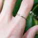 14kt white gold low dome wedding ring worn on a hand