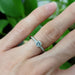 14kt white gold moissanite and lab diamond ring shown on hand
