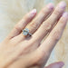 14kt white gold oval lab diamond engagement ring with pave band shown on hand