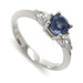 14kt white gold ring with round blue Montana sapphire and two pear cut lab grown diamonds