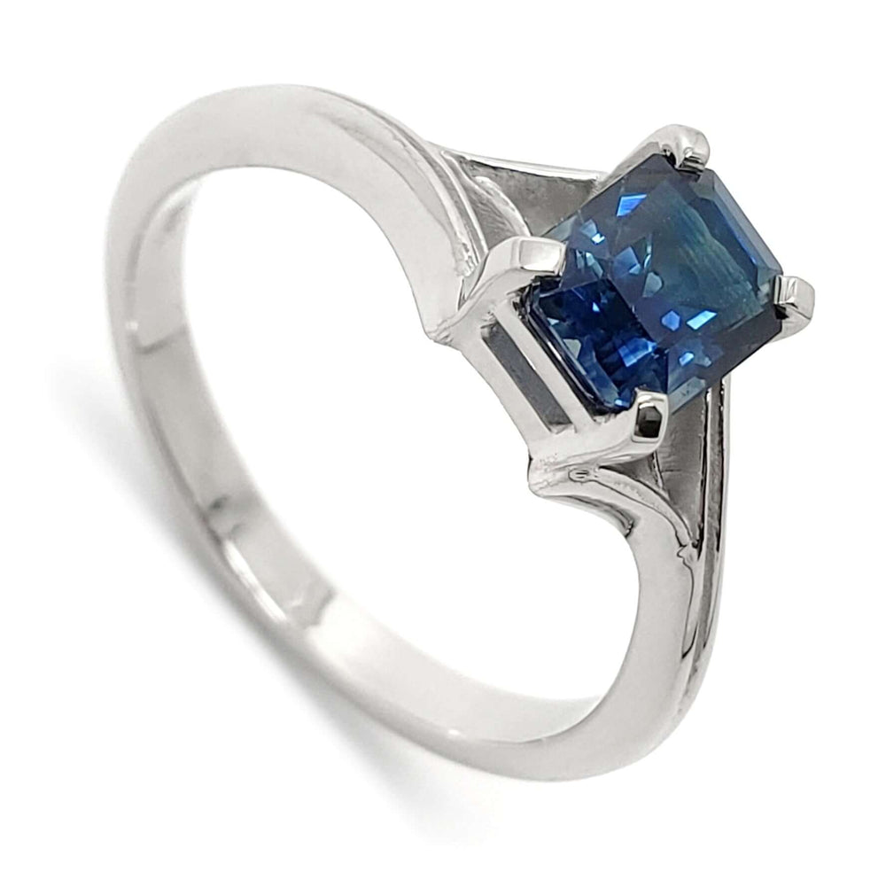14kt white gold ring with emerald cut blue Montana sapphire, twig-inspired band