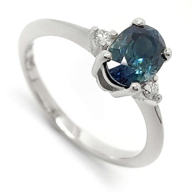 14kt white gold ring with oval teal Australian sapphire and two lab diamond accents