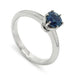 14kt white gold solitaire ring with round blue Montana sapphire in six-claw setting